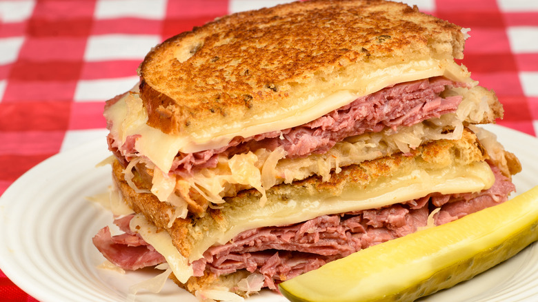 Corned beef, swiss, sauerkraut on toasted rye with pickle