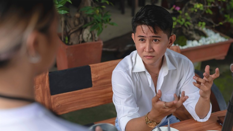 Restaurant customer complaining to server