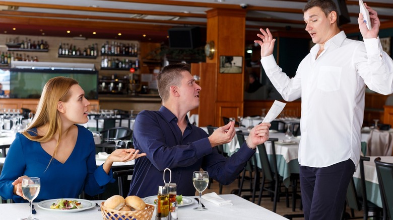 Restaurant customers complaining about bill to server