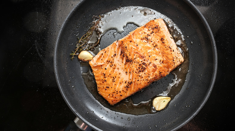 Salmon on pan with olive oil