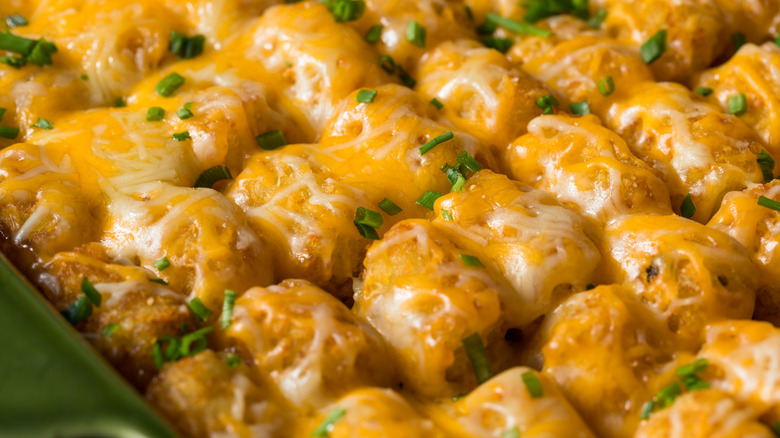 A closeup of a cheesy tater tot casserole