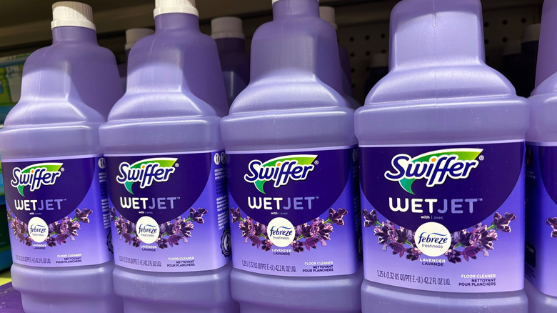 A row of bottled Swiffer brand WetJet floor cleaner