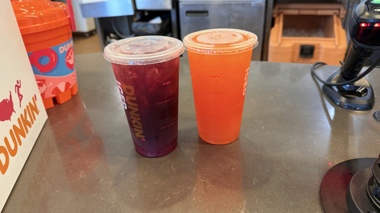 two Dunkin' Refreshers at the checkout counter of Dunkin'