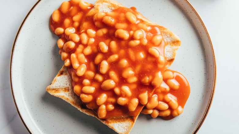 Beans on toast on a white plate
