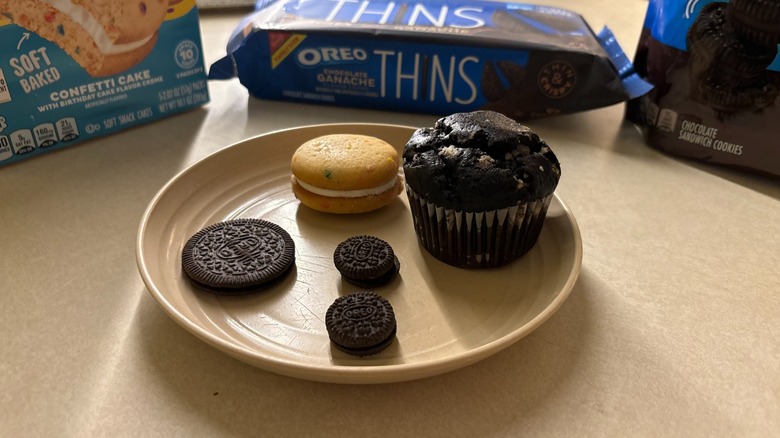 Four winter Oreo snacks 2025 on a plate with packets behind it