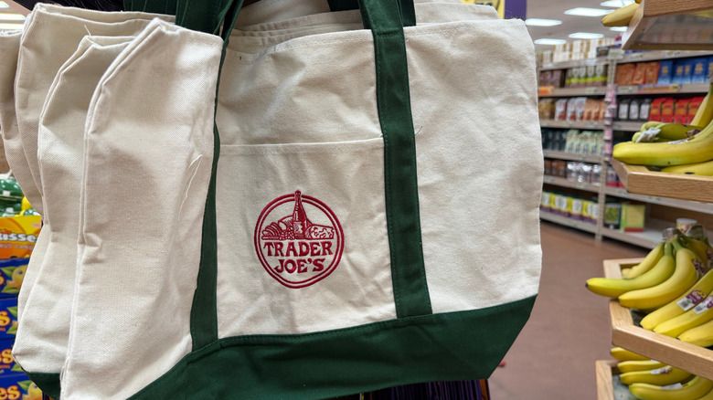 Shopper with Trader Joe's tote bag