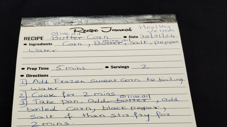 A recipe card with two ingredients crossed out and replaced