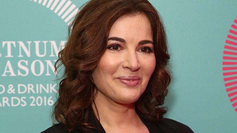 Nigella Lawson poses in a black outfit at an awards event