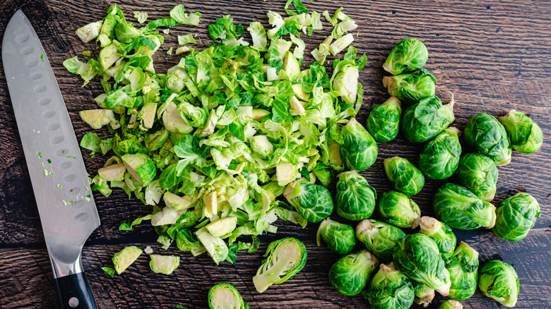 Brussels sprouts whole and cut into smaller pieces with a knife