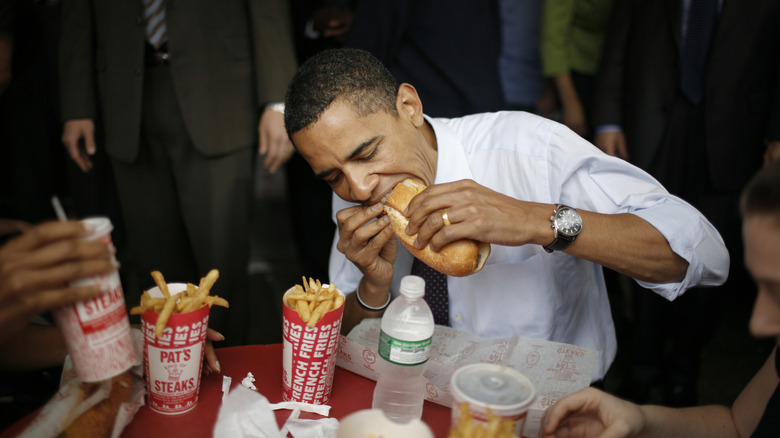 Democratic presidential candidate Senator Barack Obama (D-IL) eats a cheesesteak and fries during a campaign stop at Pat's King of Steaks in Philadelphia, Pennsylvania.