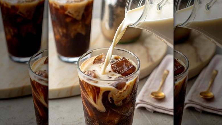 Pouring creamer into iced coffee in a glass