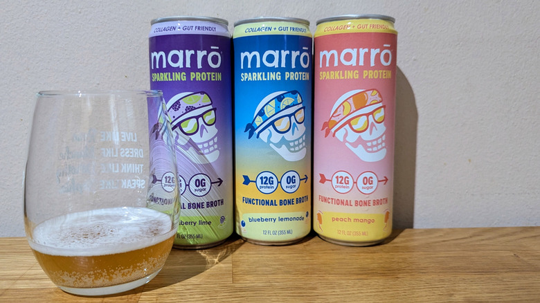 Marrō sparkling beverage lineup with glass partially filled with drink.