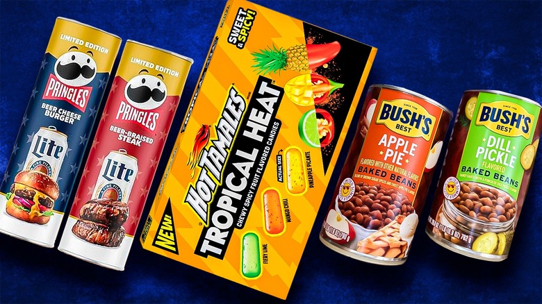 Hot Tamales, baked beans, and Pringles on blue background