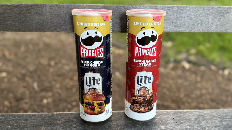Pringles x Miller Lite canisters on a park bench