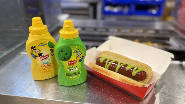 Bottles of French's Minions Yellow Mustard and Goomi's Green Mustard, which dresses a hot dog