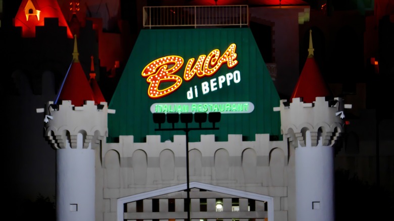 The castle-shaped sign of a Buca Di Beppo restaurant.