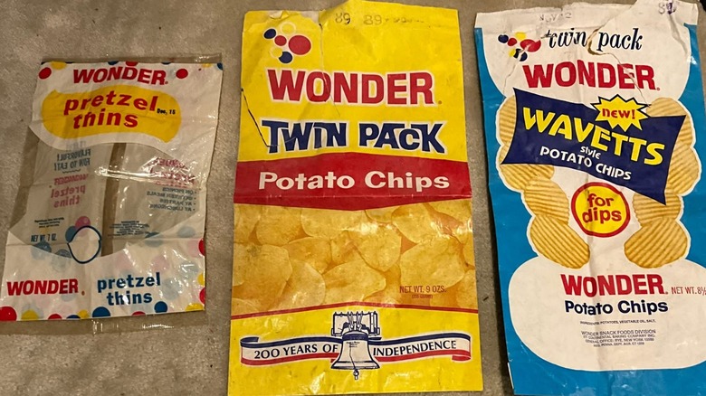 three vintage bags of salty snacks from Wonder, including pretzel thins, potato chips, and wavy potato chips