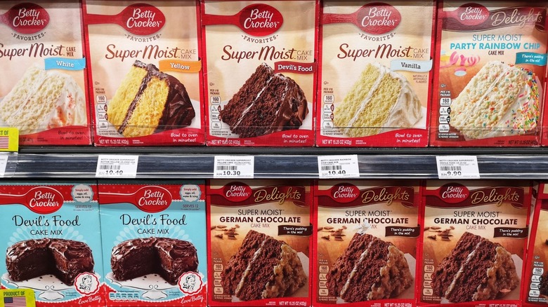 Various flavors of Betty Crocker cake mix on store shelf