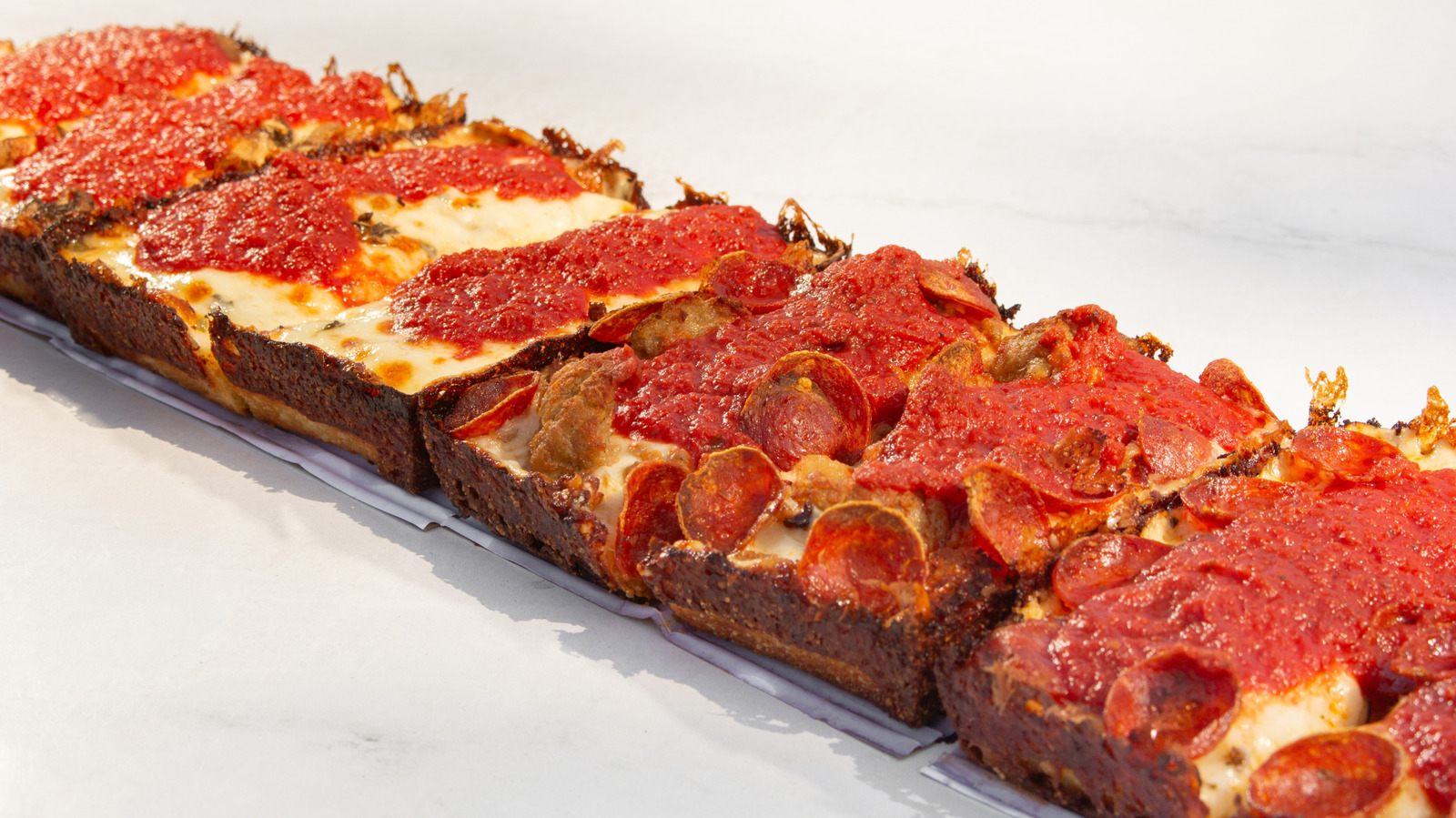 Not Mozzarella, Not Cheddar: This Is The Cheese You Need For Detroit-Style Pizza