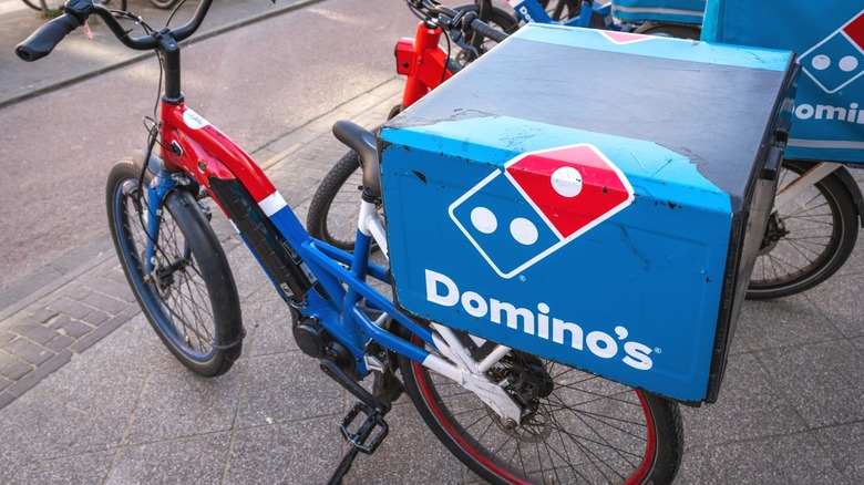 Domino's Pizza delivery bicycles parked in the street