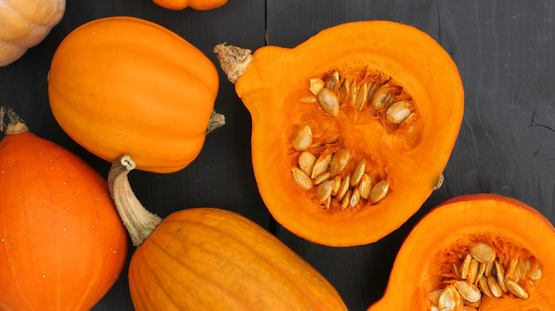 split pumpkins with seeds