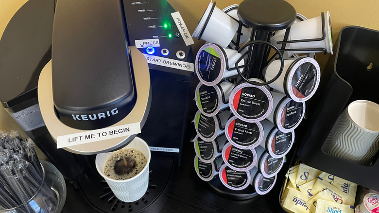 A Keurig coffee machine and K-cups for guests