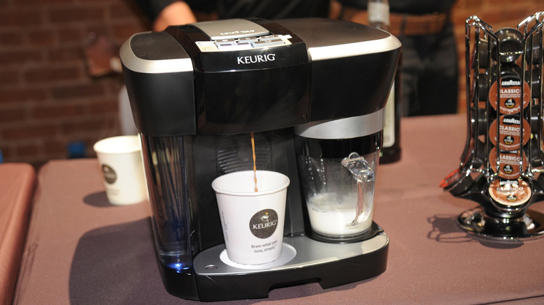 A Keurig coffee machine brewing coffee