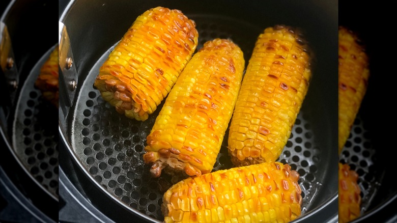 Browned corn in air fryer basket