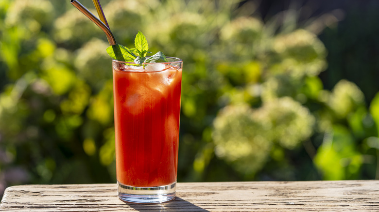 tomato juice in glass with straws