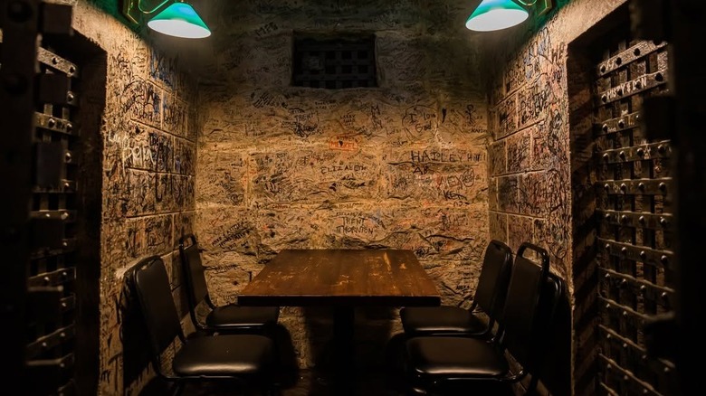 A dining booth in a cell in Cahoots in Fayetteville, Tennessee
