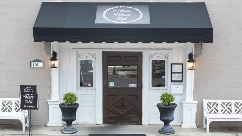 The outside of Main Street Cafe with white and black decor
