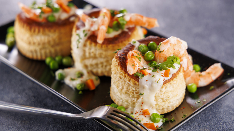 Vol-au-vents stuffed with creamy shrimp and peas