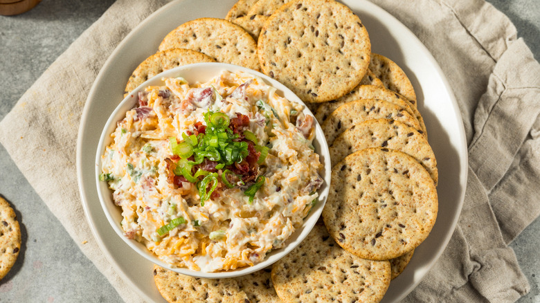 A bowl of million-dollar dip with crackers
