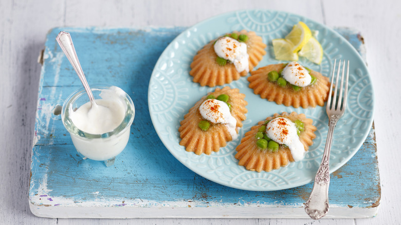 Four molded salmon mousses on a blue plate