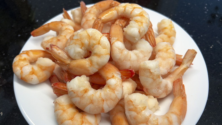 Cooked shrmip on a white plate