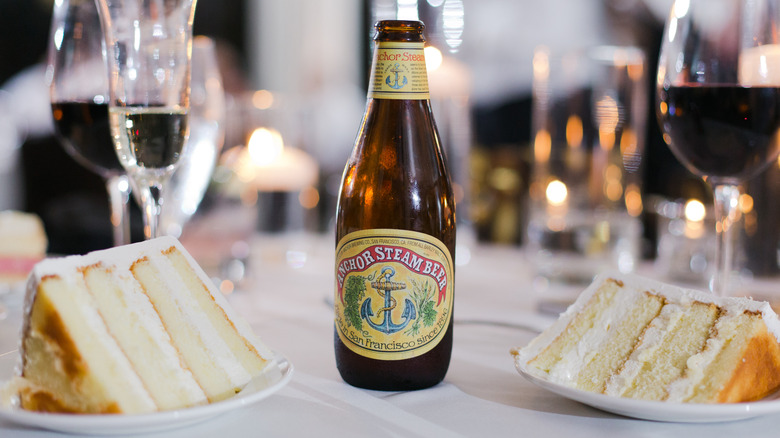 Anchor Steam Beer on a table with cake and wine
