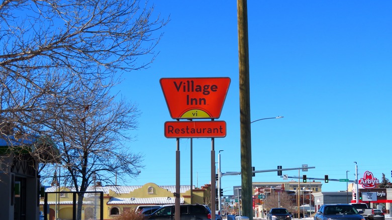 Village Inn external sign on a sunny day
