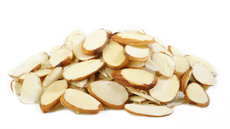 Sliced almonds on a white background