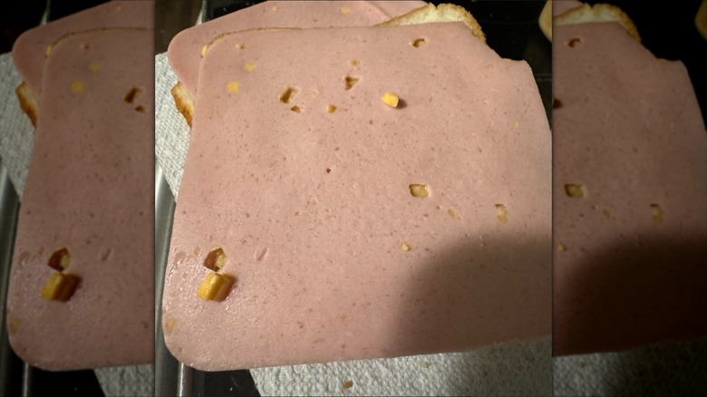 Sliced ham and cheese loaf on bread