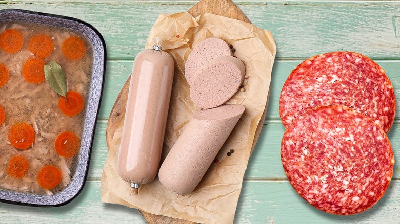 various deli meats arranged on a wooden slab