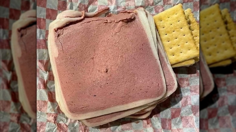 sliced liver cheese with crackers