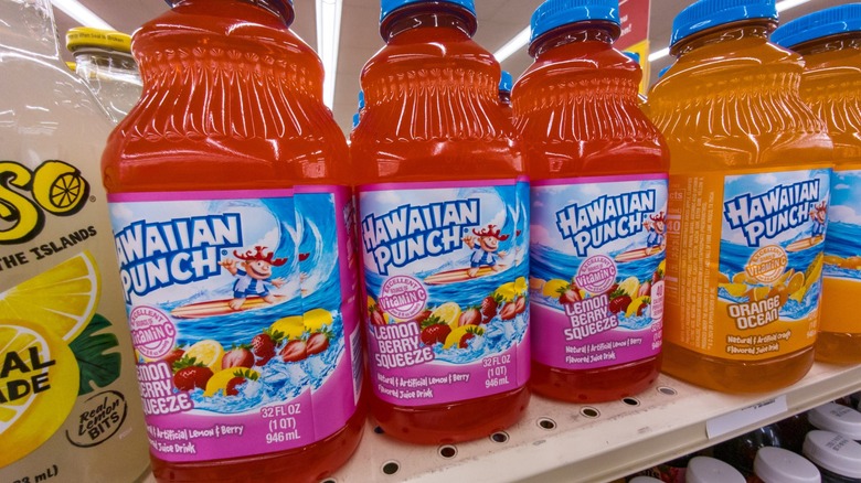Colorful Hawaiian Punch bottles on a grocery store shelf
