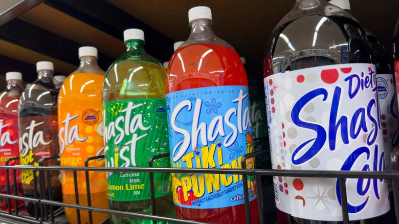 Several 2-liter bottles of Shasta soda at a grocery store