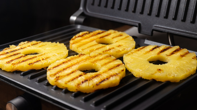 Pineapple slices on a grill