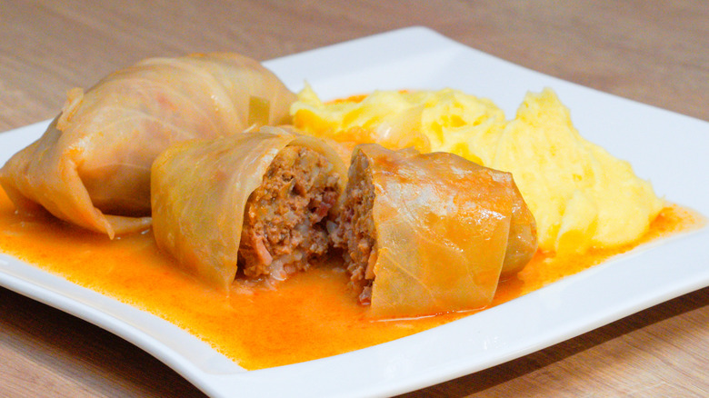 Stuffed cabbage rolls on a white plate