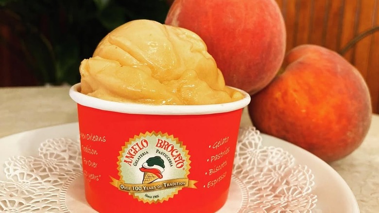 Peach Italian ice cream in small paper cup