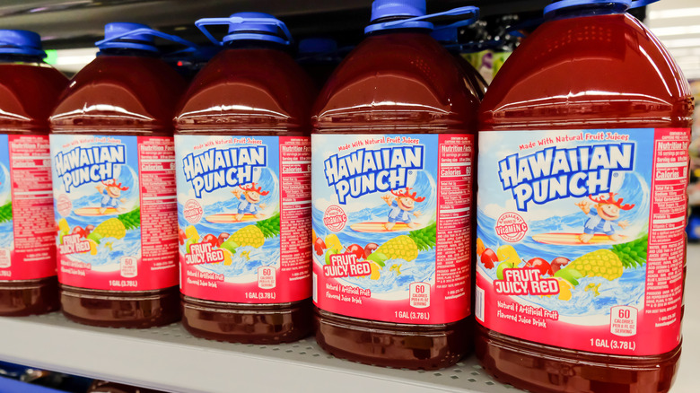 Large plastic bottles of Hawaiian Punch Fruit Juicy Red on shelves