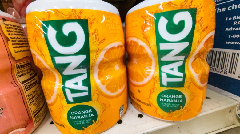 Two containers of orange Tang