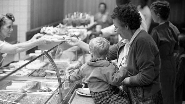 Woman and baby at Morrisons cafeteria line