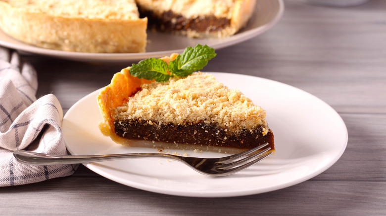 Slice of shoofly pie on a plate with a fork